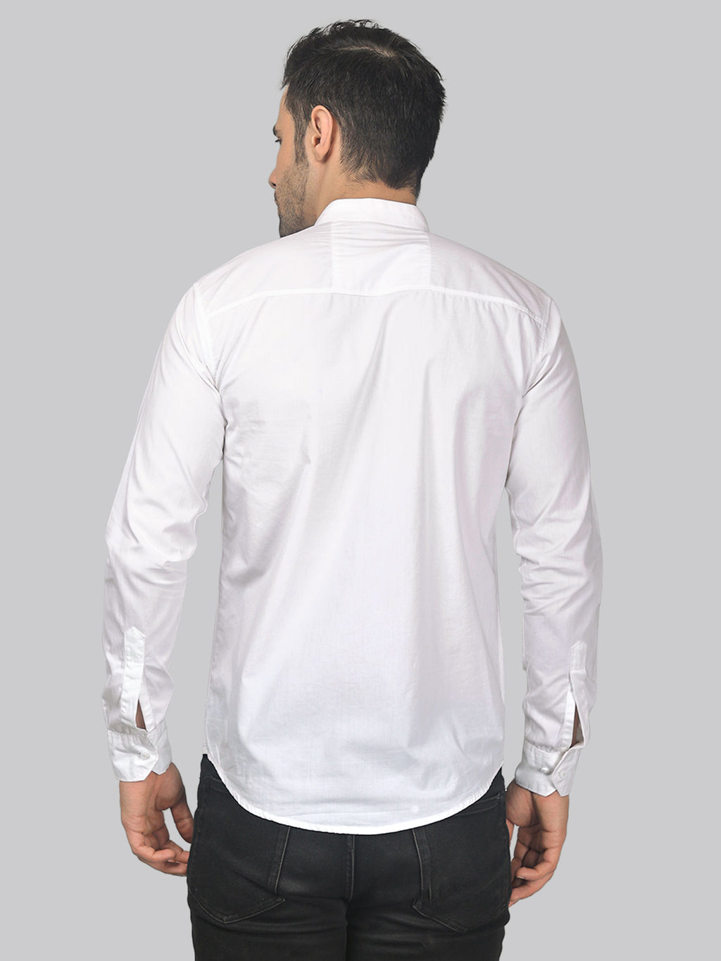 a man wearing a white shirt and black pants