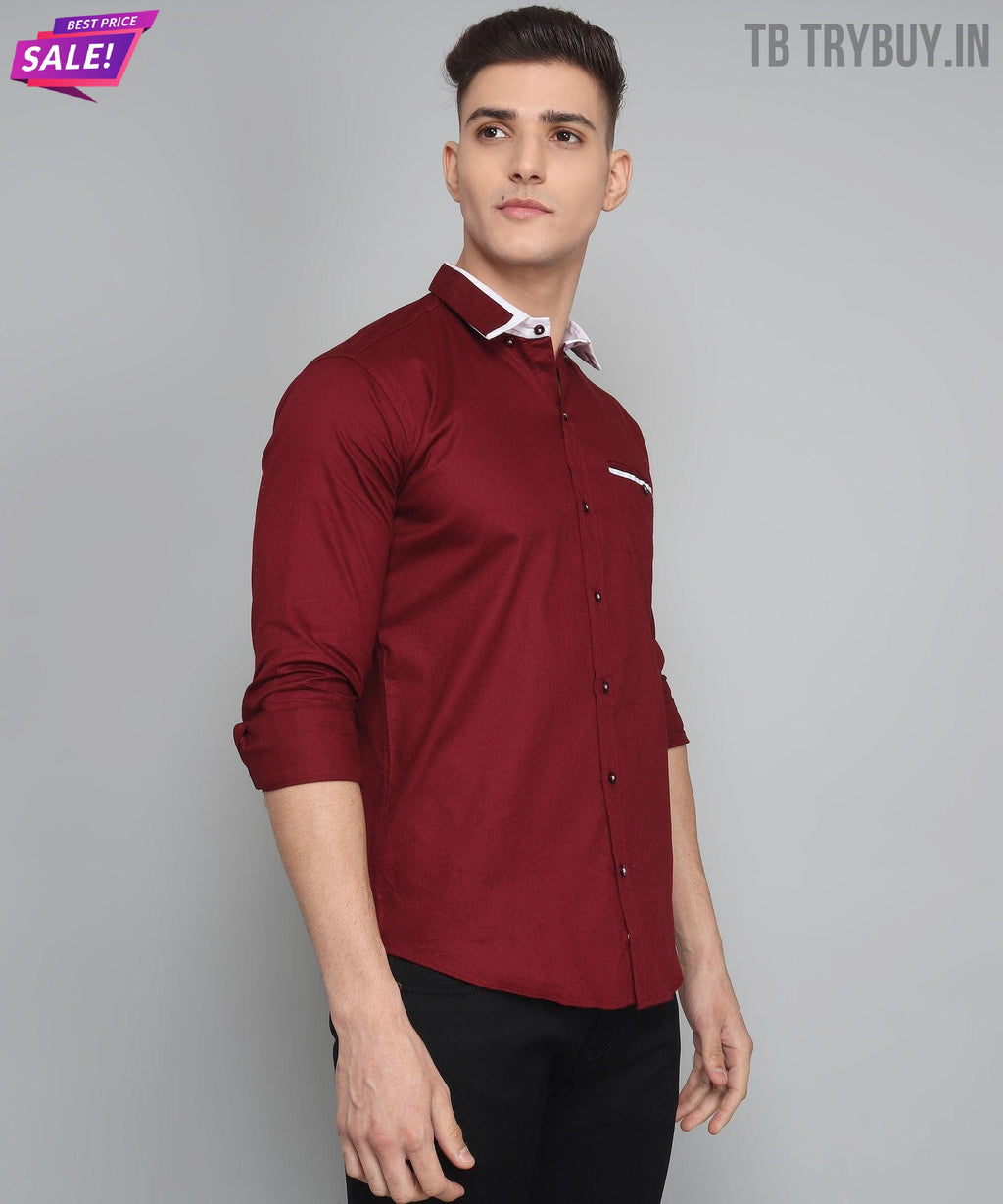 a man wearing a red shirt and black pants