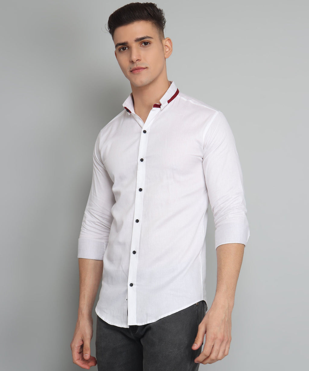a man wearing a white shirt and black pants