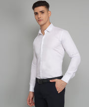 a man wearing a white shirt and black pants