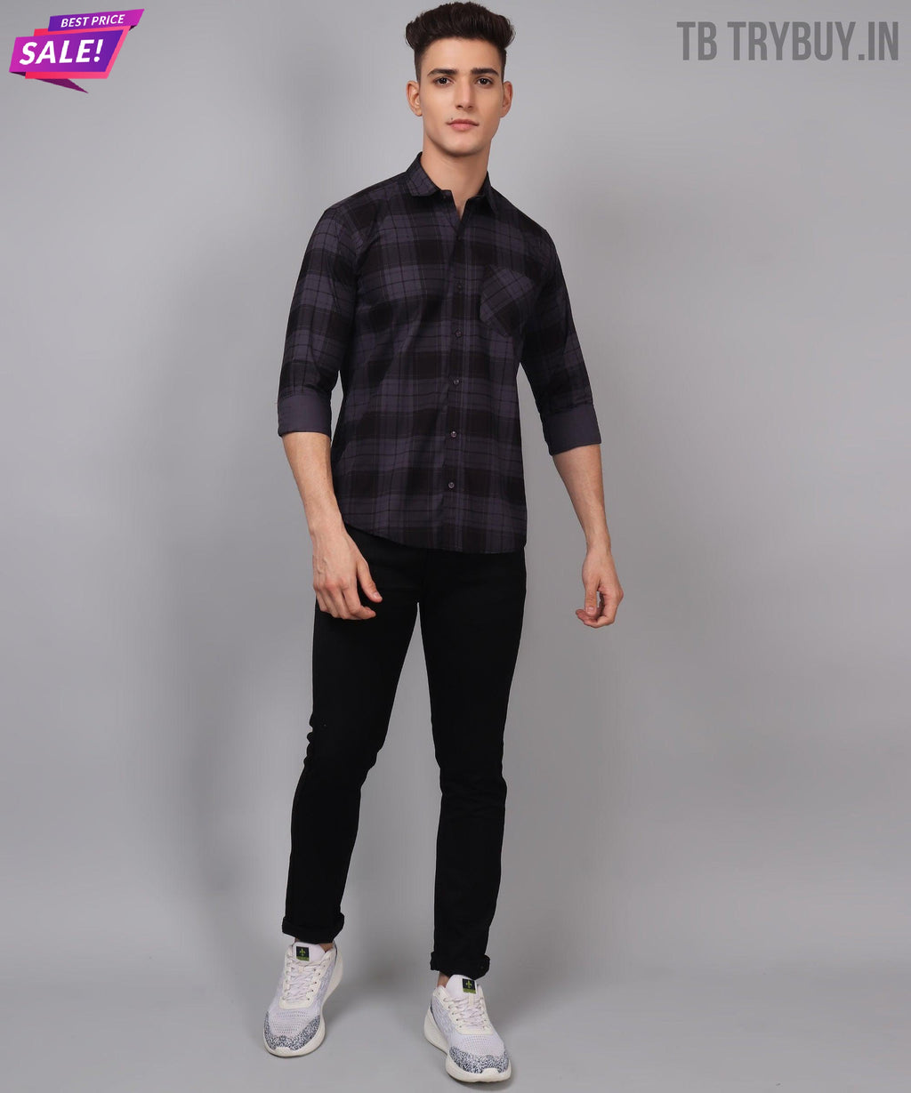 a man in a black and grey checkered shirt