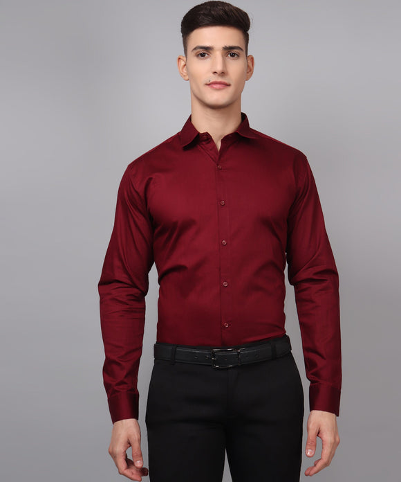 a man wearing a red shirt and black pants