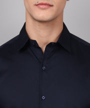 a man wearing a black shirt and glasses