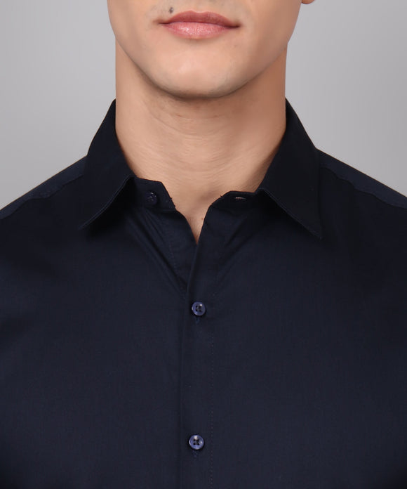 a man wearing a black shirt and glasses