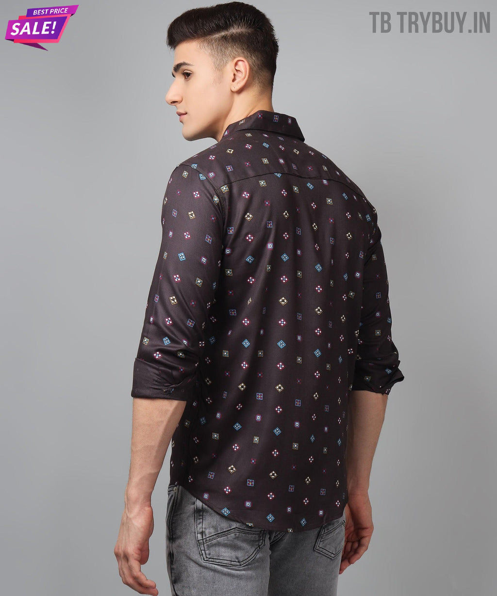 a man wearing a black shirt with colorful squares on it
