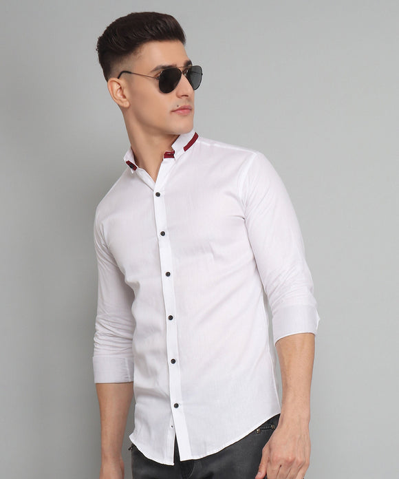 a man wearing sunglasses and a white shirt