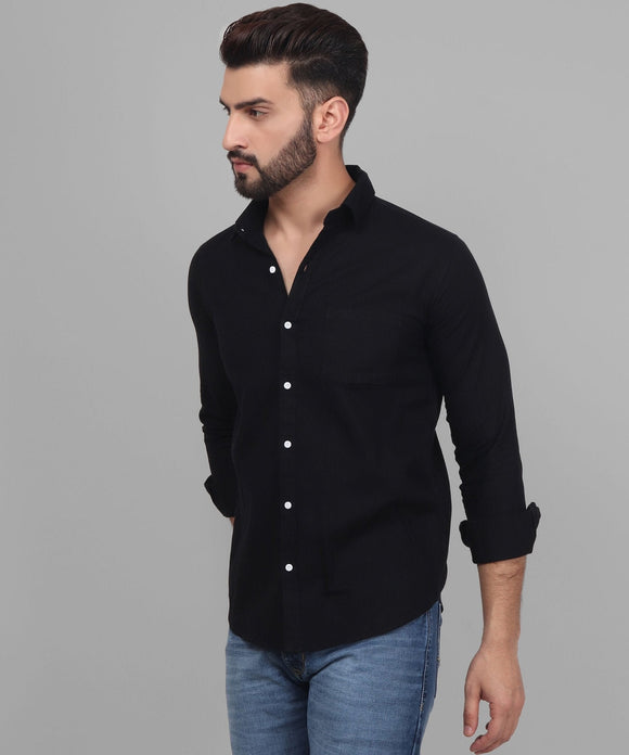 a man wearing a black shirt and jeans