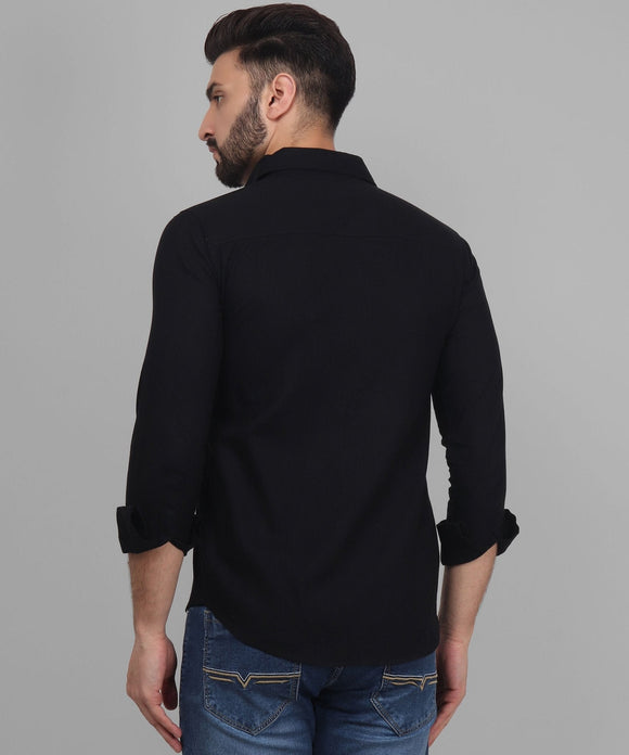 a man wearing a black shirt and jeans