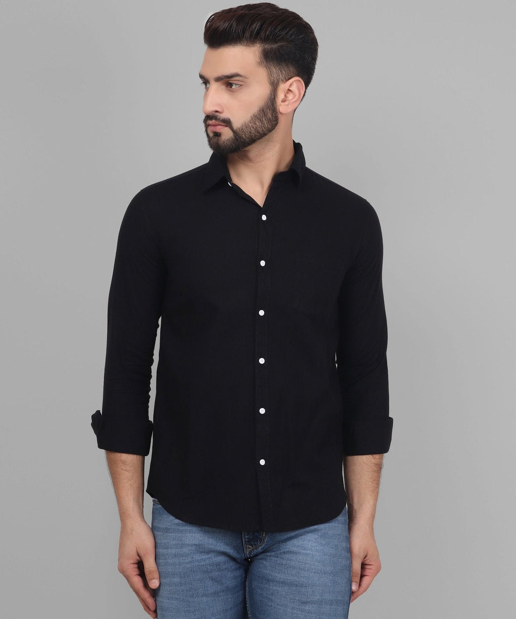 a man wearing a black shirt and jeans