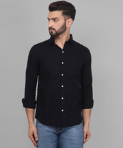 a man wearing a black shirt and jeans