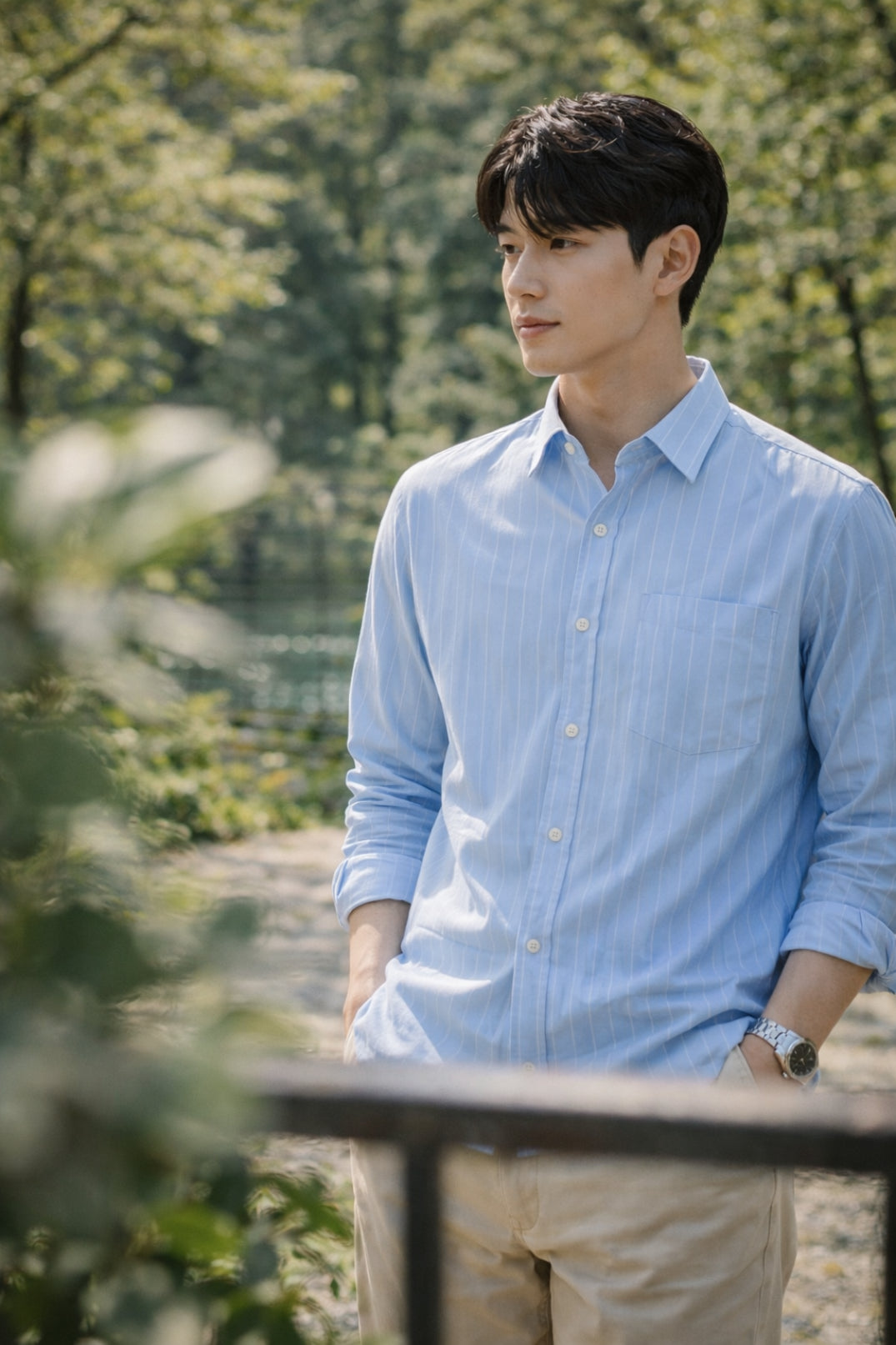 Man wearing a light blue striped slim-fit shirt