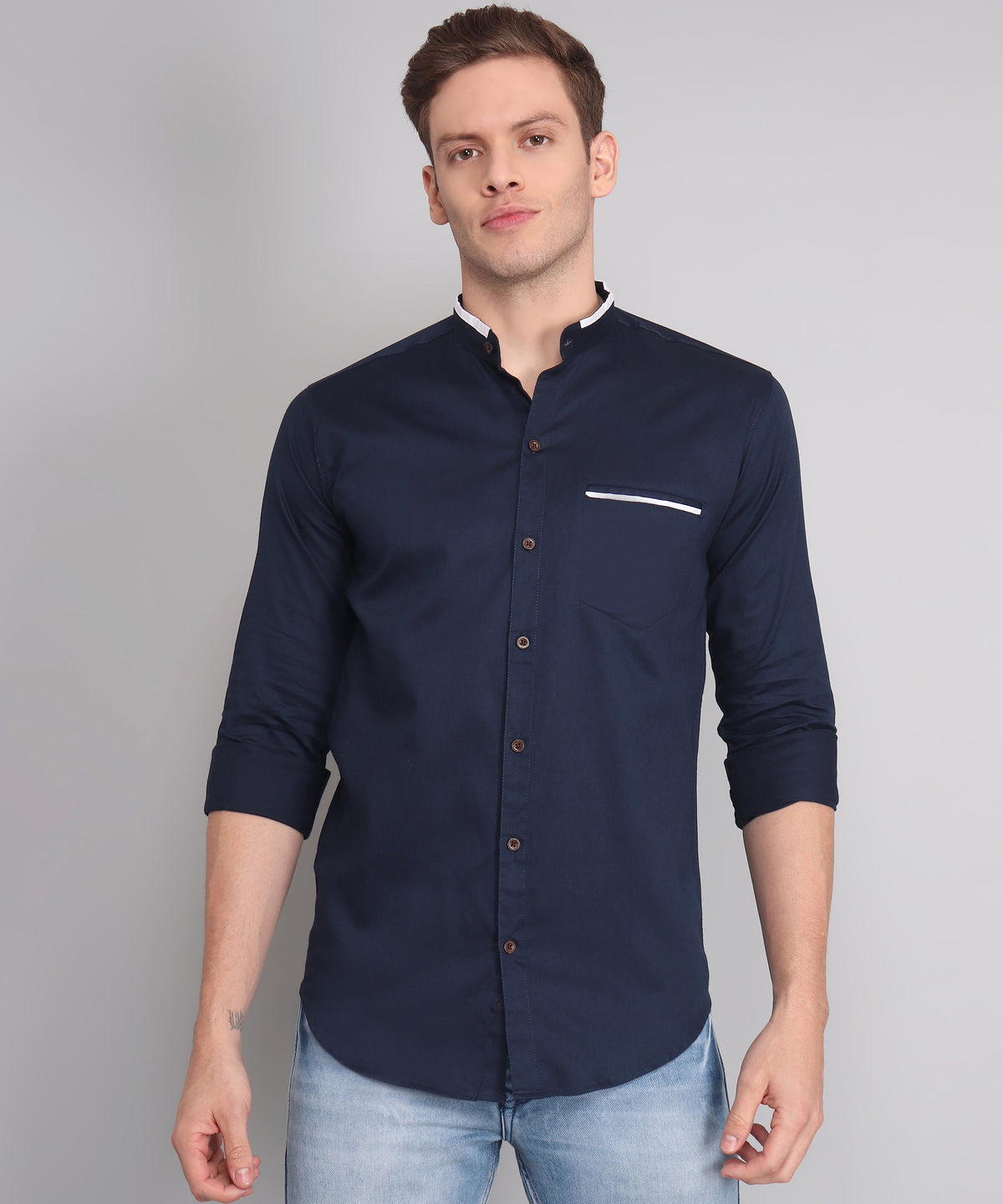 Man wearing an Oxford-style button-down shirt