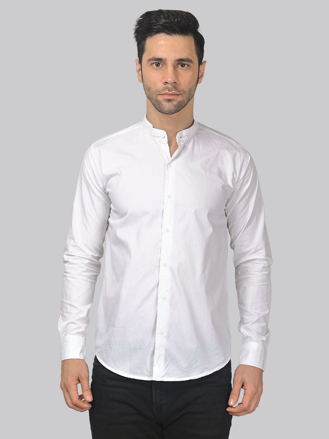 a man wearing a white shirt and black pants
