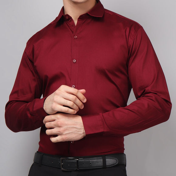 a man wearing a red shirt and black pants