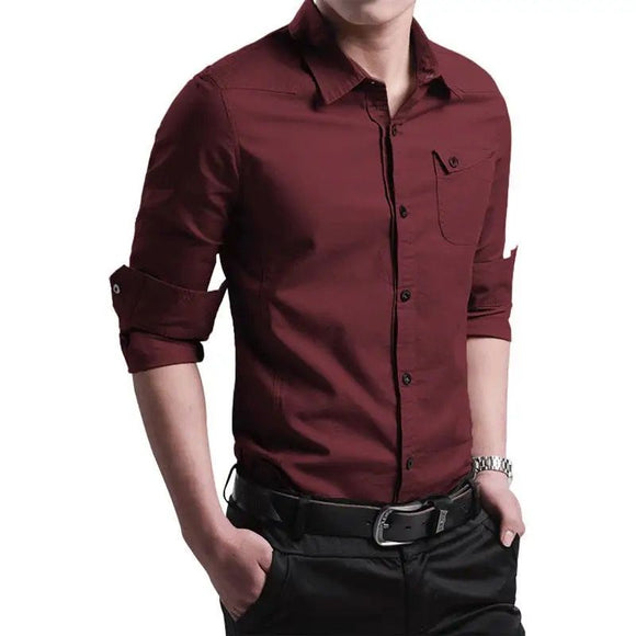 a man wearing a red shirt and black pants