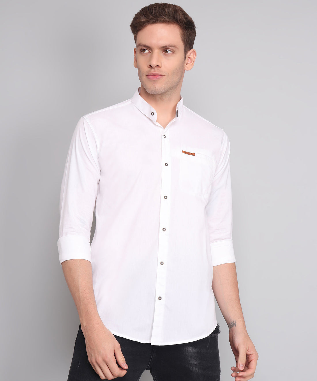 
a man wearing a white shirt and black pants

