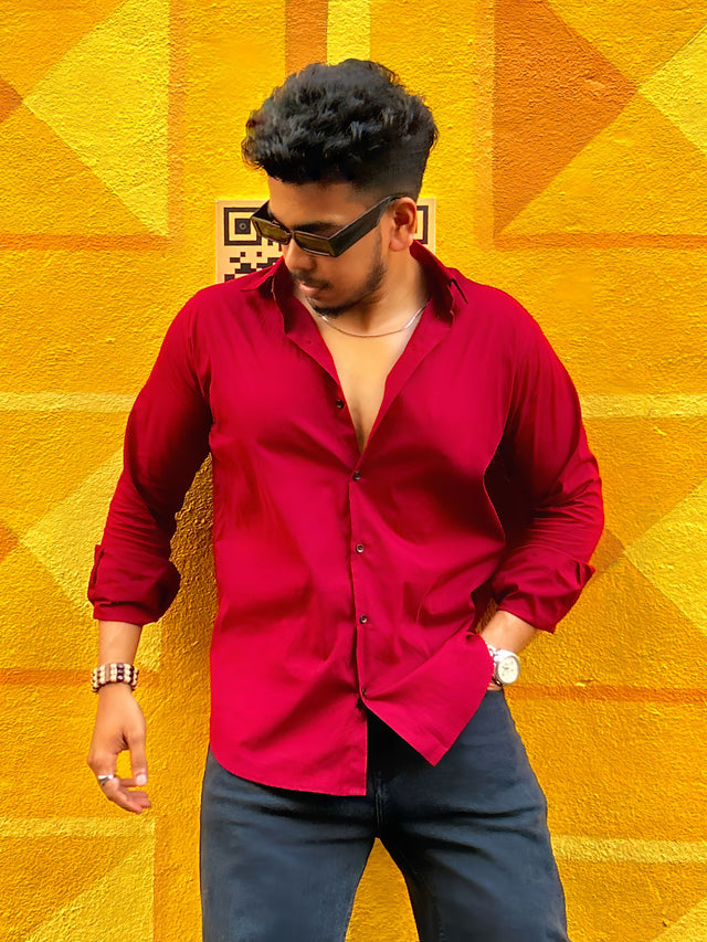 a man standing in front of a yellow wall
