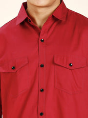 a close up of a person wearing a red shirt