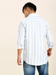 a man wearing a white and blue striped shirt