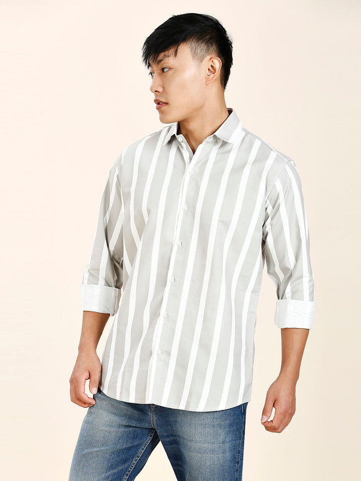 a man in a white and black striped shirt