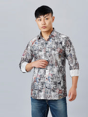 a man in a patterned shirt poses for a picture