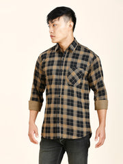 a man in a brown and black checkered shirt