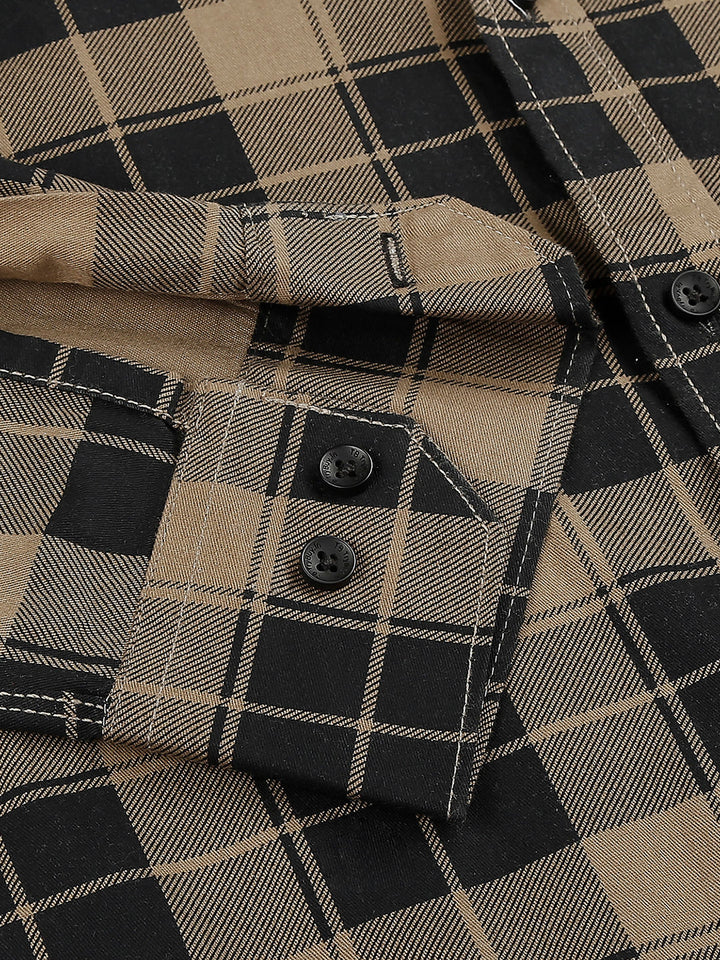 a black and tan checkered shirt with buttons