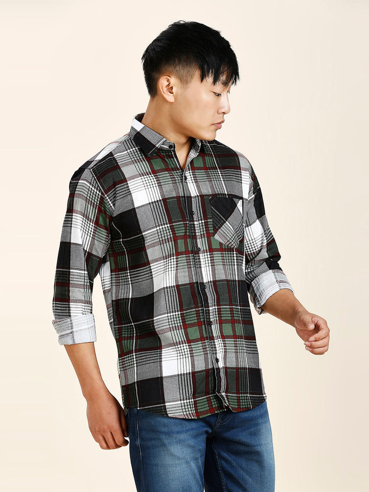 a man in a black and white plaid shirt