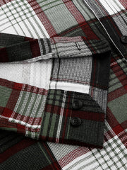 a close up of a shirt with a plaid pattern