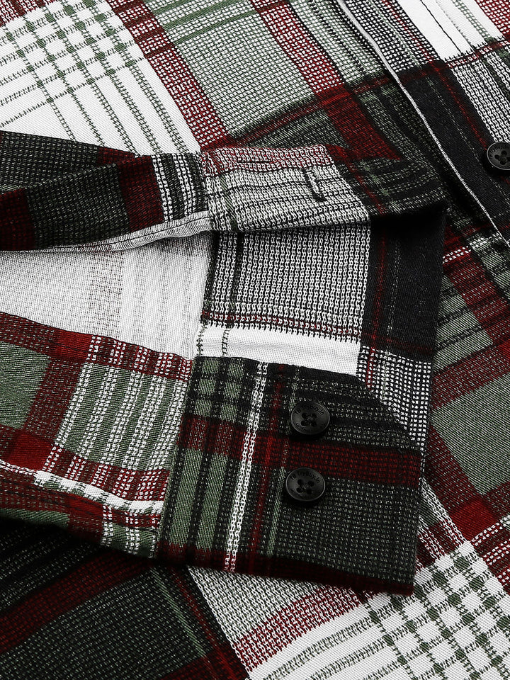 a close up of a shirt with a plaid pattern