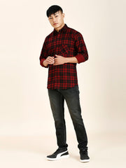 a man in a red and black plaid shirt