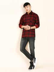 a man in a red and black checkered shirt