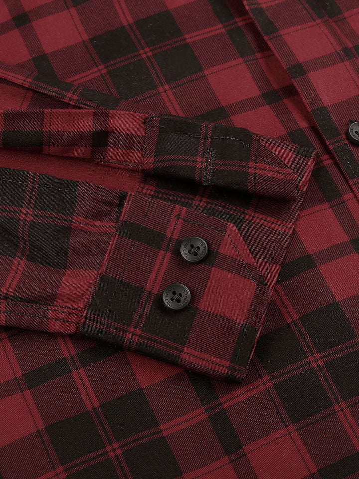 a close up of a red and black plaid shirt