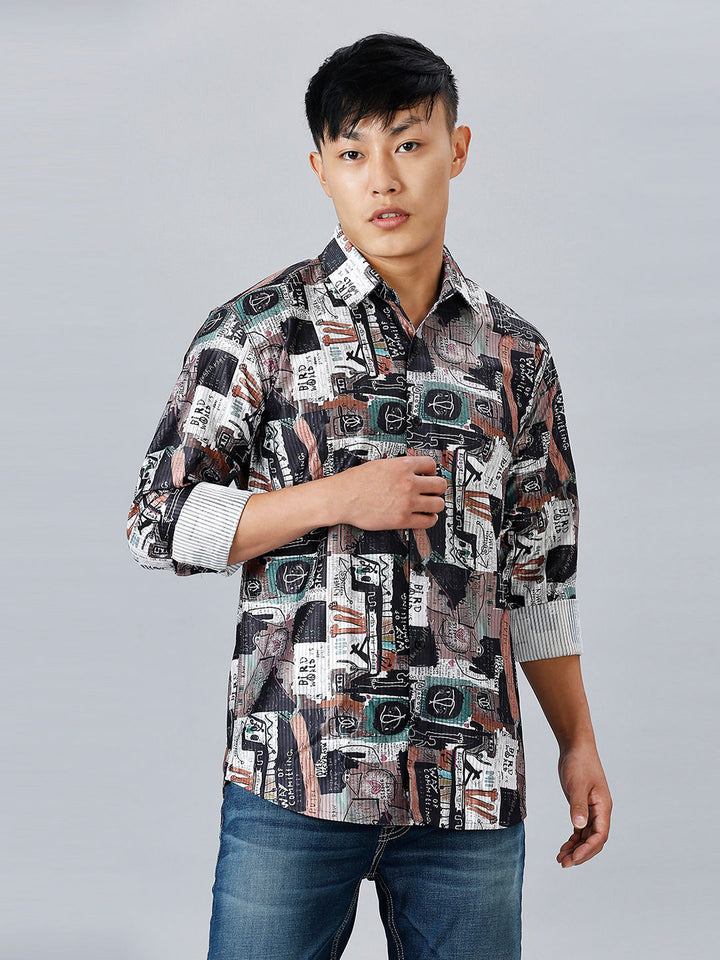 a man in a patterned shirt poses for a picture