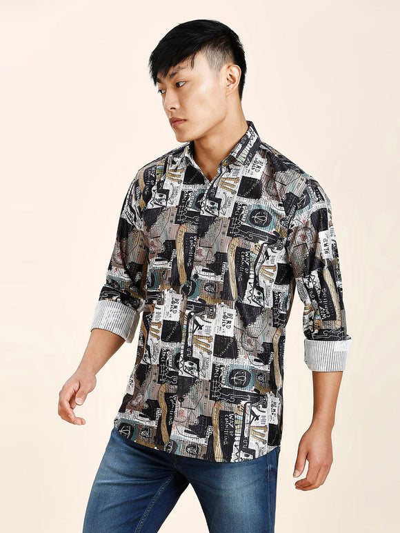 a man in a black and white shirt and jeans