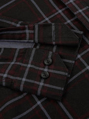 a close up of a shirt with a checkered pattern