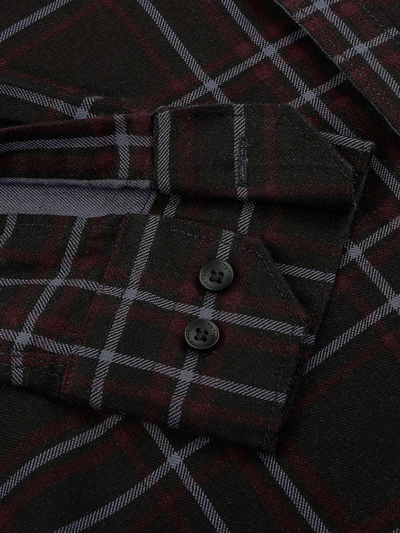 a close up of a shirt with a checkered pattern
