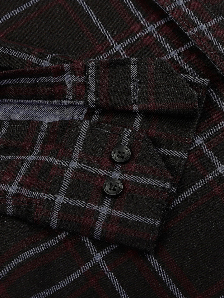 a close up of a shirt with a checkered pattern