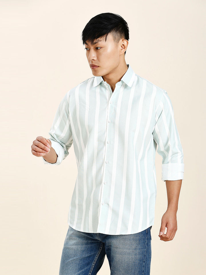 a man in a white and blue striped shirt