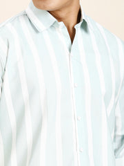 a man wearing a blue and white striped shirt