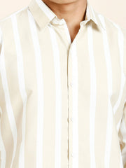 a man wearing a white and black striped shirt