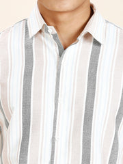 a close up of a person wearing a striped shirt