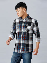 a man in a black and white plaid shirt