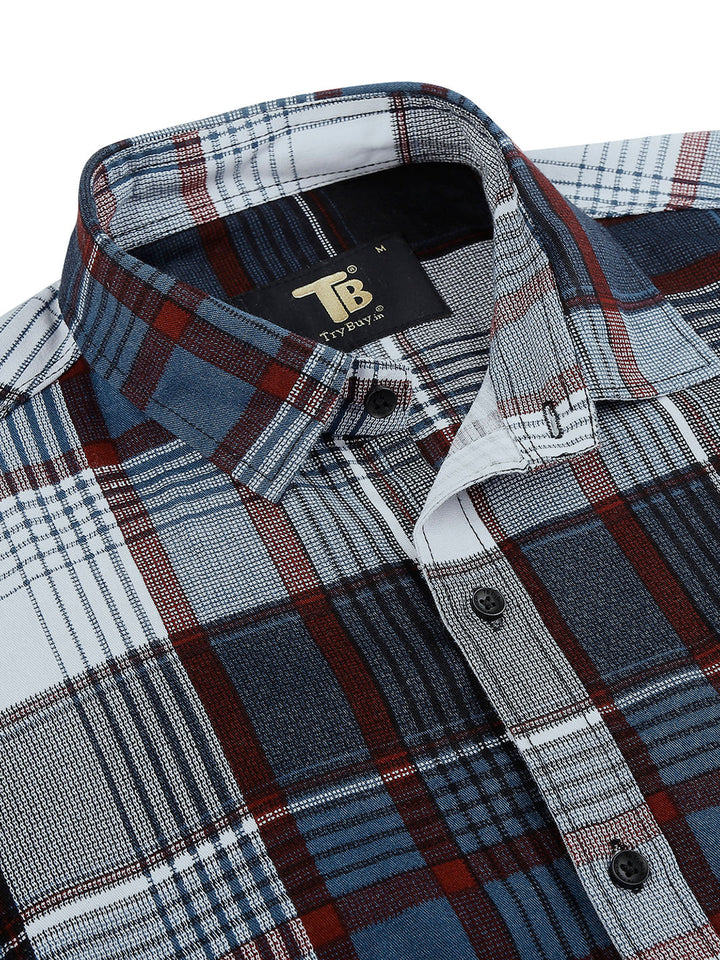 a plaid shirt with a tag on the chest