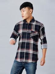 a man in a black and white plaid shirt