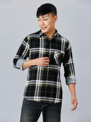 a man in a black and white plaid shirt