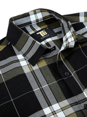 a close up of a black and white plaid shirt