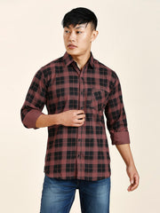 a man in a red and black checkered shirt