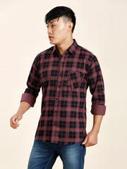 a man in a red and black checkered shirt