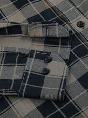 a close up of a shirt with a checkered pattern